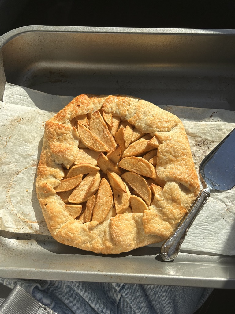 Freshly baked apple galette in a pan, ready to be taken to a friend’s home